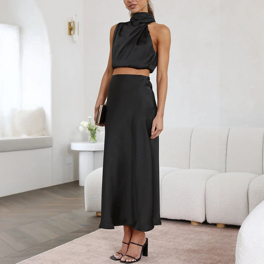 Abito Elegante con Top Halter e Gonna Fluttuante