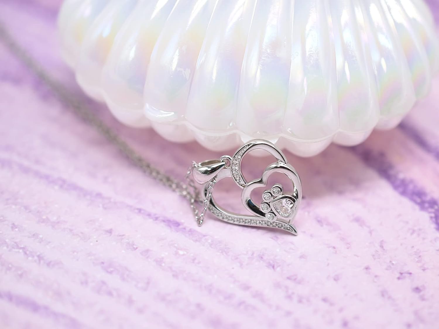 Collana in argento sterling con zampa e cuore con zirconi