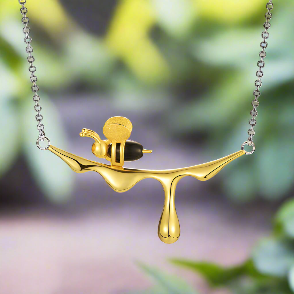 Collana con miele che gocciola e ape